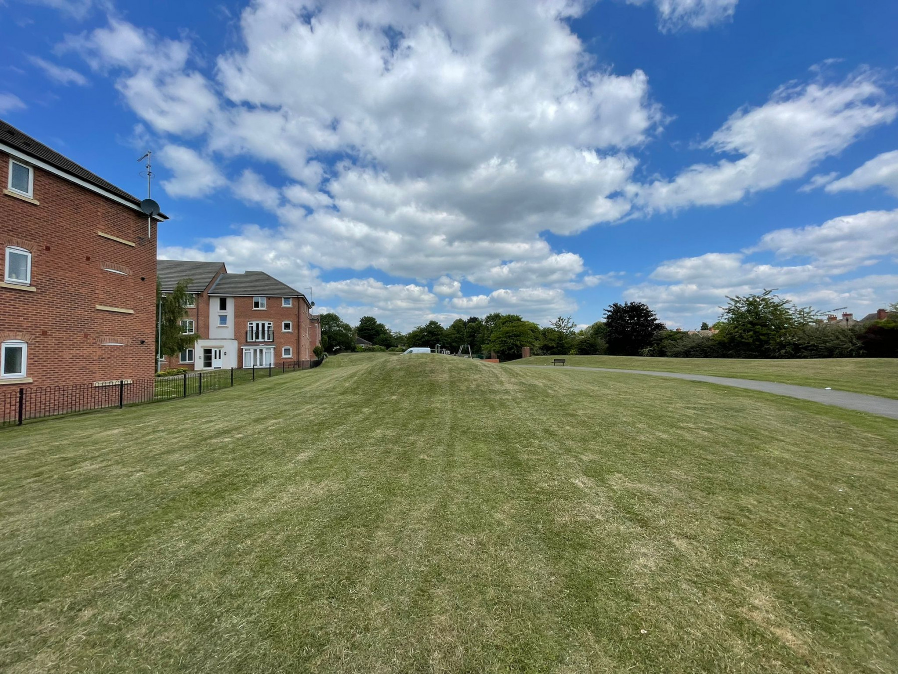 Striped lawns maintained by Landywood at an apartment development