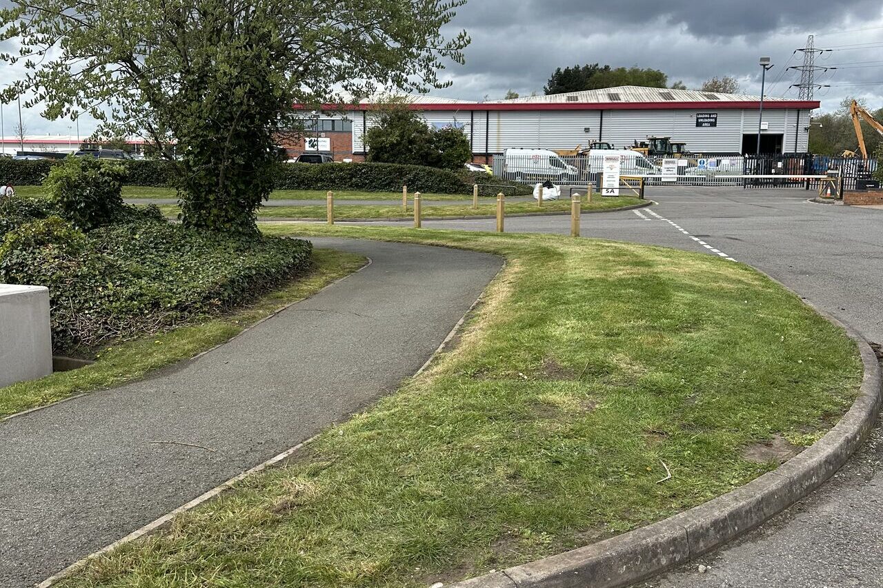 Maintained grass verge and footpath at a Midlands industrial estate